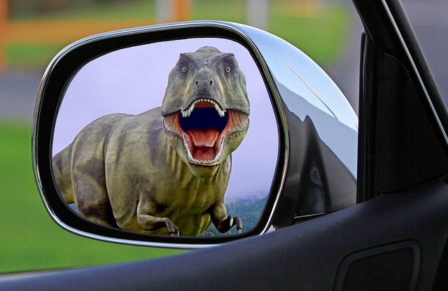 Picture of a T-Rex in rearview mirror